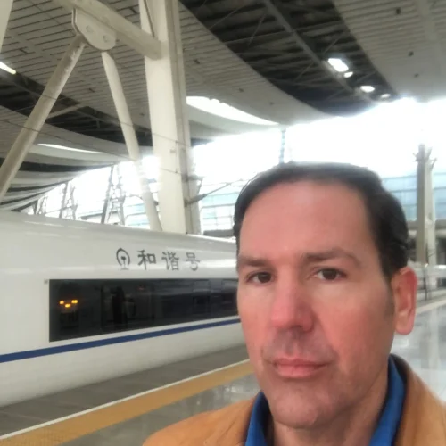 Author Lance Hoovestal standing with the ship