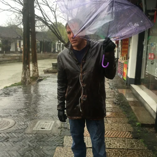 Author Lance Hoovestal holding the ambrella