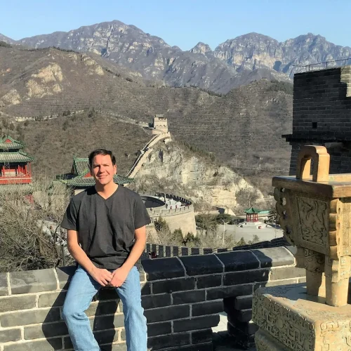 Author Lance Hoovestal sitting on the wall