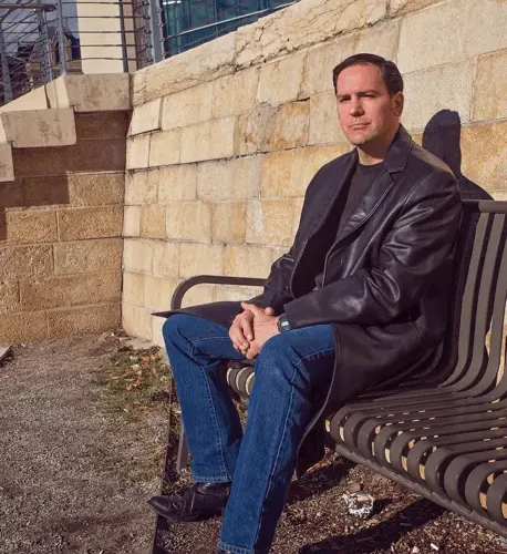 Author Lance Hoovestal siiting on the bench