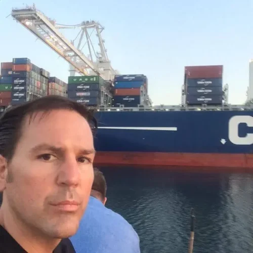 Author Lance Hoovestal selfie with cargo ship